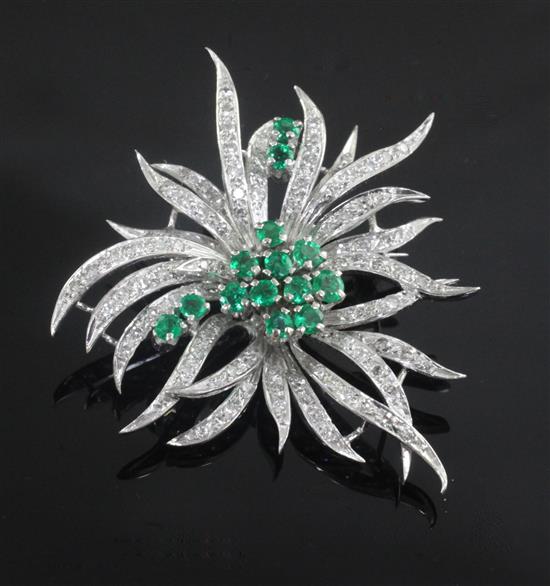 An 18ct white gold and platinum, emerald and diamond set spray brooch, 48mm.